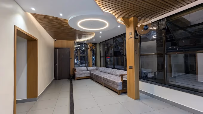 Amrut Inn Murudeshwar modern lobby interior with stylish ceiling design and comfortable seating