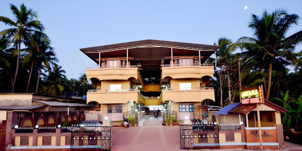Aryan Residency Murudeshwar - Modern beachfront guest house near Murudeshwar Temple with palm trees