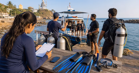 Scuba check-in at Murudeshwar harbor with booking checklist and dive boat