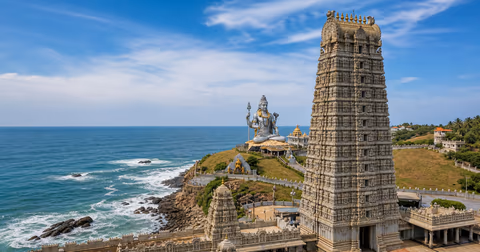 Murudeshwar Temple Raja Gopura, seated Shiva statue and Arabian Sea coastline
