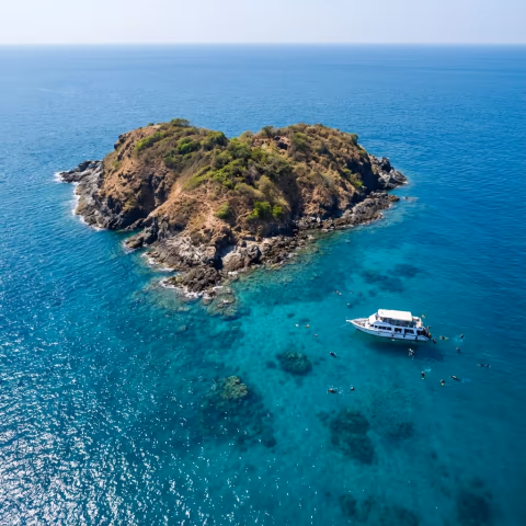 Aerial view of heart-shaped Netrani Island with crystal clear blue waters
