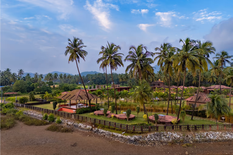 Relaxing riverside gazebo seating at Pushkar Cottages